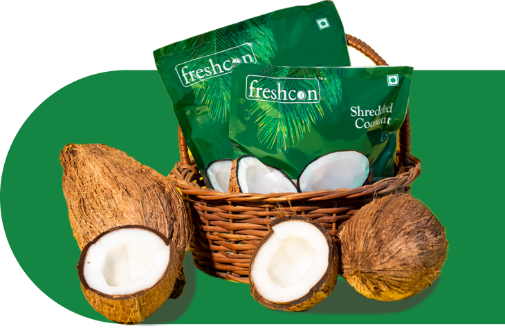 Freshcon Shredded Coconut packs in a basket with fresh coconuts